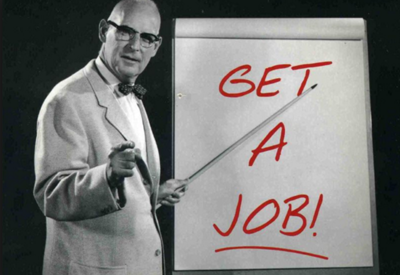 Man pointing to whiteboard that says "get a job"