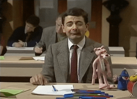 Gif. Mr Bean in an exam, crying and putting his head on his arm