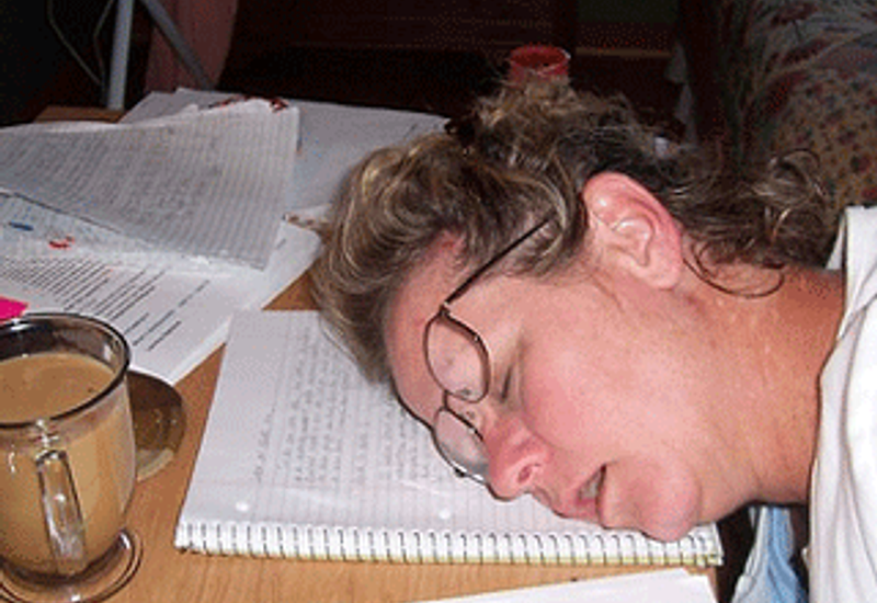 Student asleep on their notes