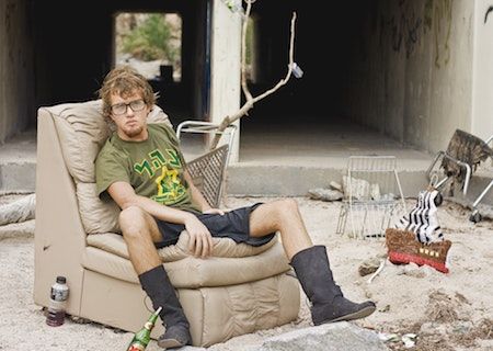 student sat on old recliner