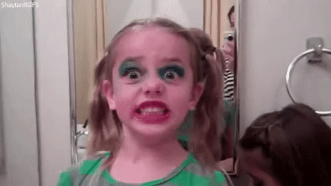 little girl with loads of makeup