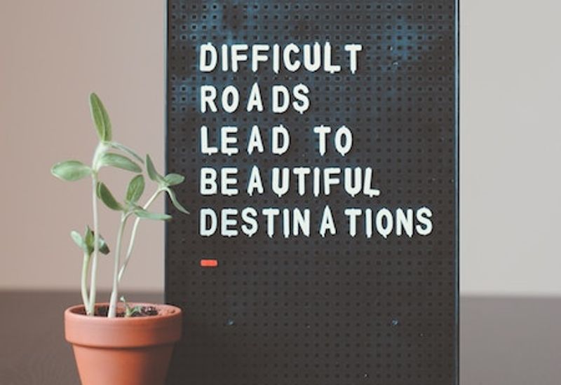 Letterboard that says: Difficult roads lead to beautiful destinations