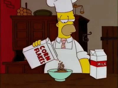 Homer Simpson putting milk and cereal in a bowl only for it to catch fire