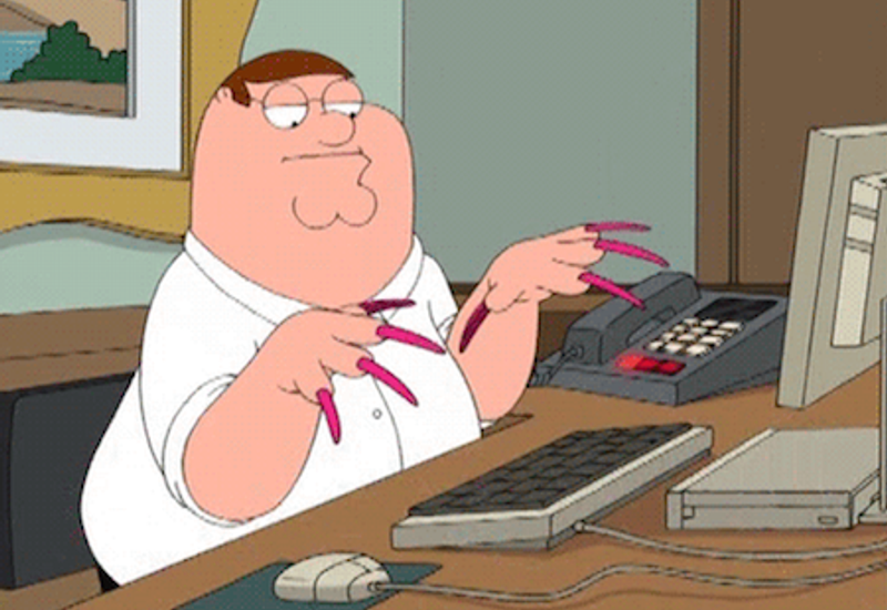 Peter Griffin with long nails typing at a keyboard