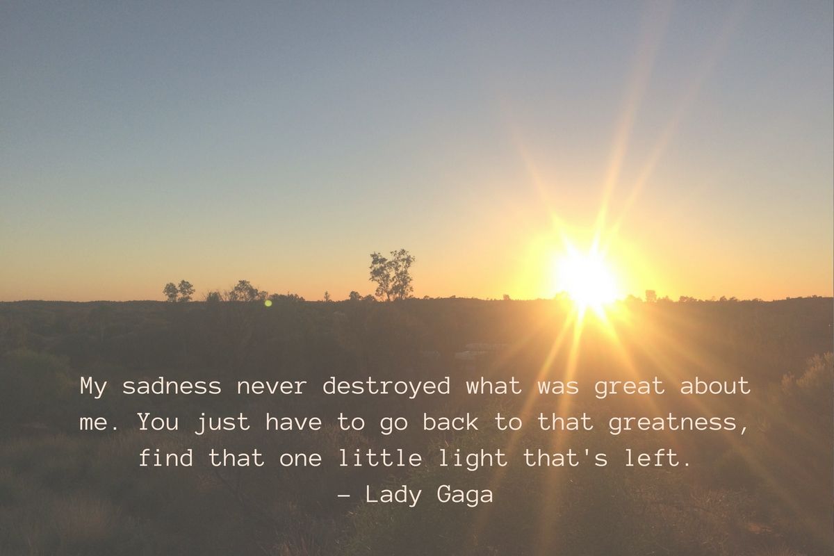 Image of sunrise and bright sunbeams. Text overlay reads: "My sadness never destroyed what was great about me. You just have to go back to that greatness, find that one little light that's left. - Lady Gaga"