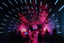People partying in an atmospherc nightclub in a student city