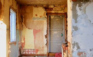 House interior in disrepair, peeling paint