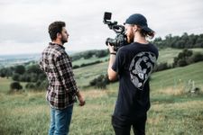 Man stood in front of cameraman in the countryside