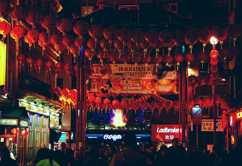 A busy Chinese New Year festival with red paper lanterns everywhere
