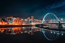 Nighttime view of the Squinty Bridge over the River Clyde