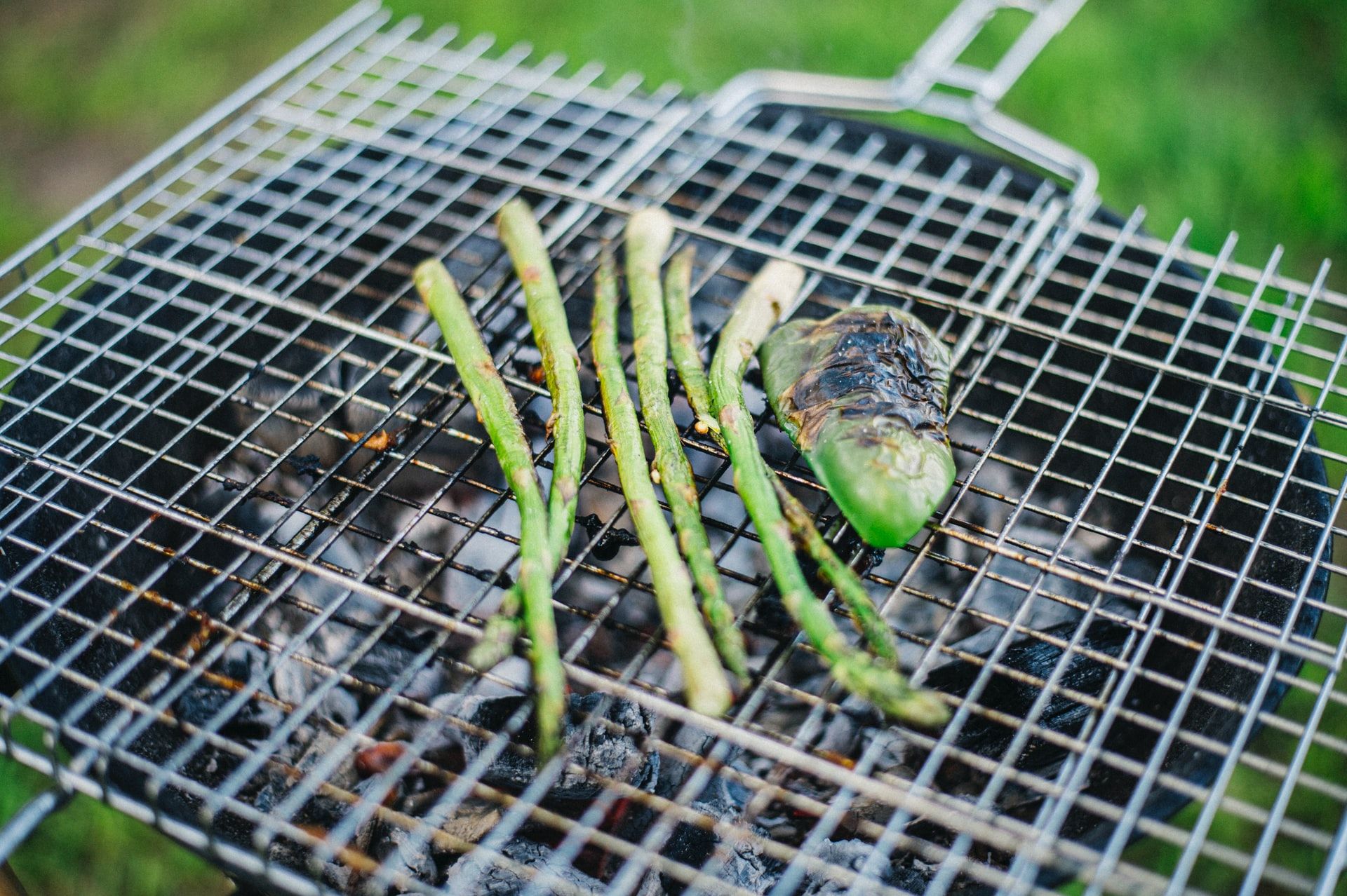 Asparagus and padron pepper on a grill