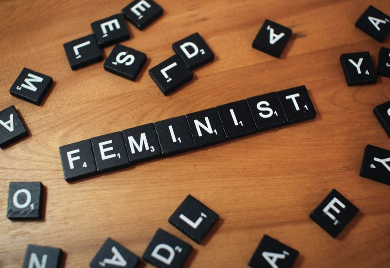 Scrabble tiles arranged to say "feminist"