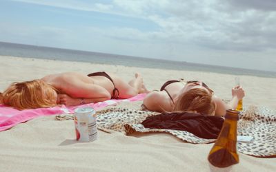 People sunbathing, protected by SPF moisturiser