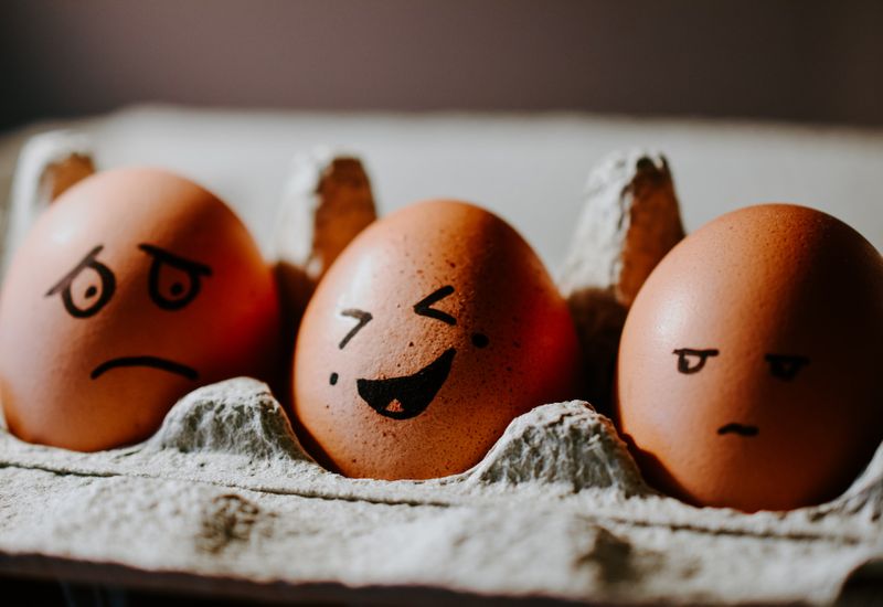 Eggs with different emotions drawn on them
