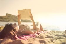 woman reading on the beach 
