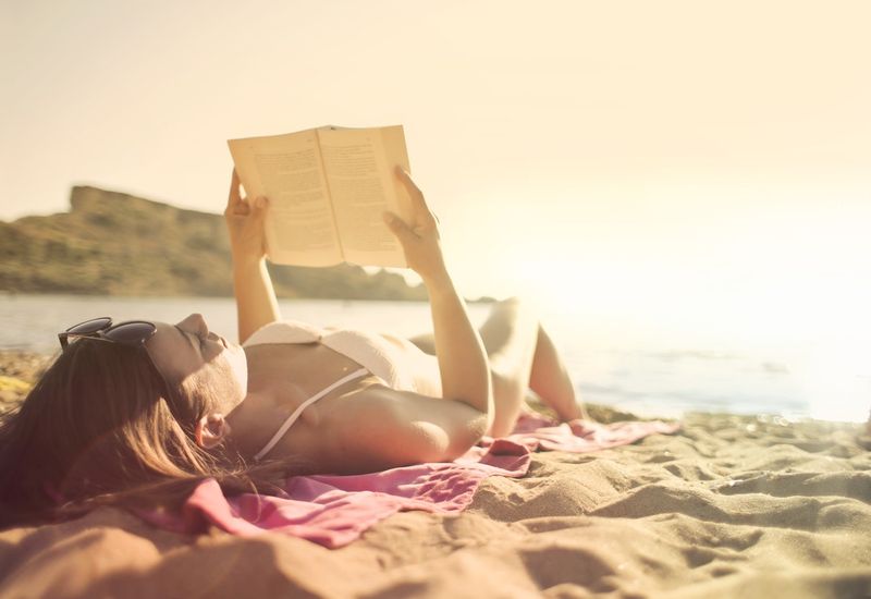 woman reading on the beach 