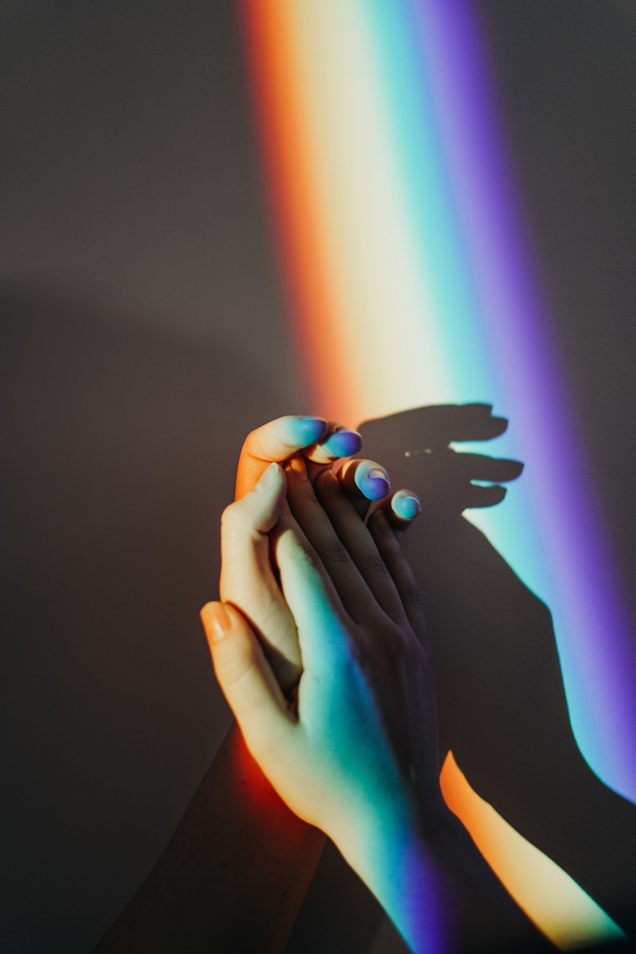 holding hands with rainbow