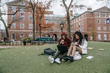 Students sat outside their university studying