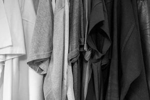 A greyscale photo of assorted clothes.