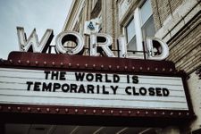 Letterboard at a theatre that says: "the world is temporarily closed"