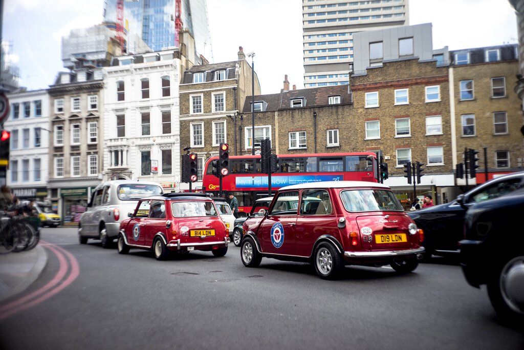 mini coopers driving in London
