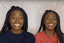 twin sisters smiling