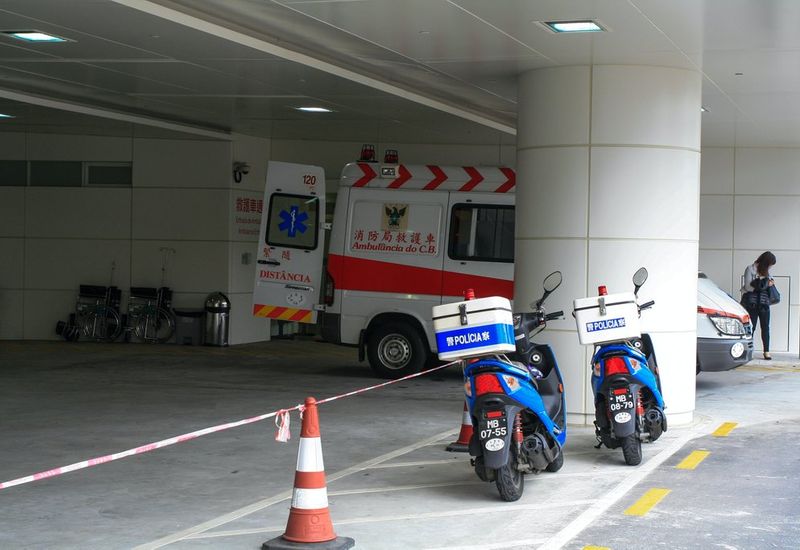 Two police bikes and an ambulance parked