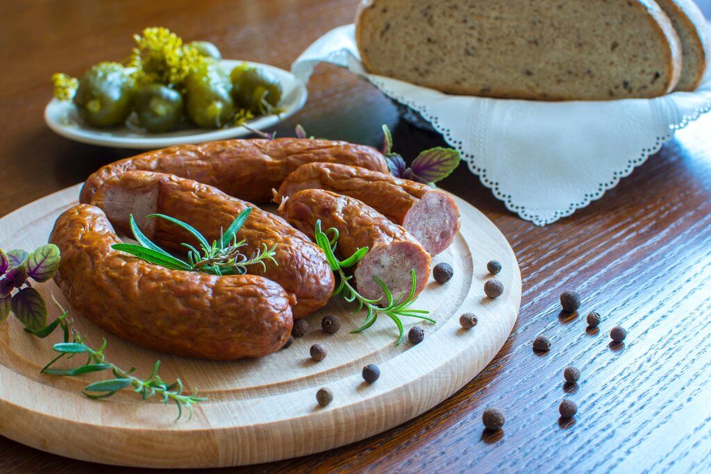 cured sausages with bread and olives