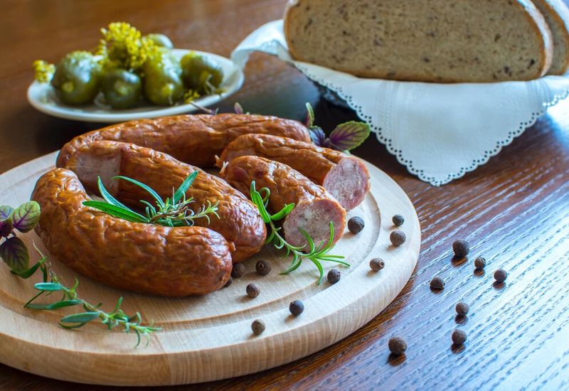 cured sausages with bread and olives