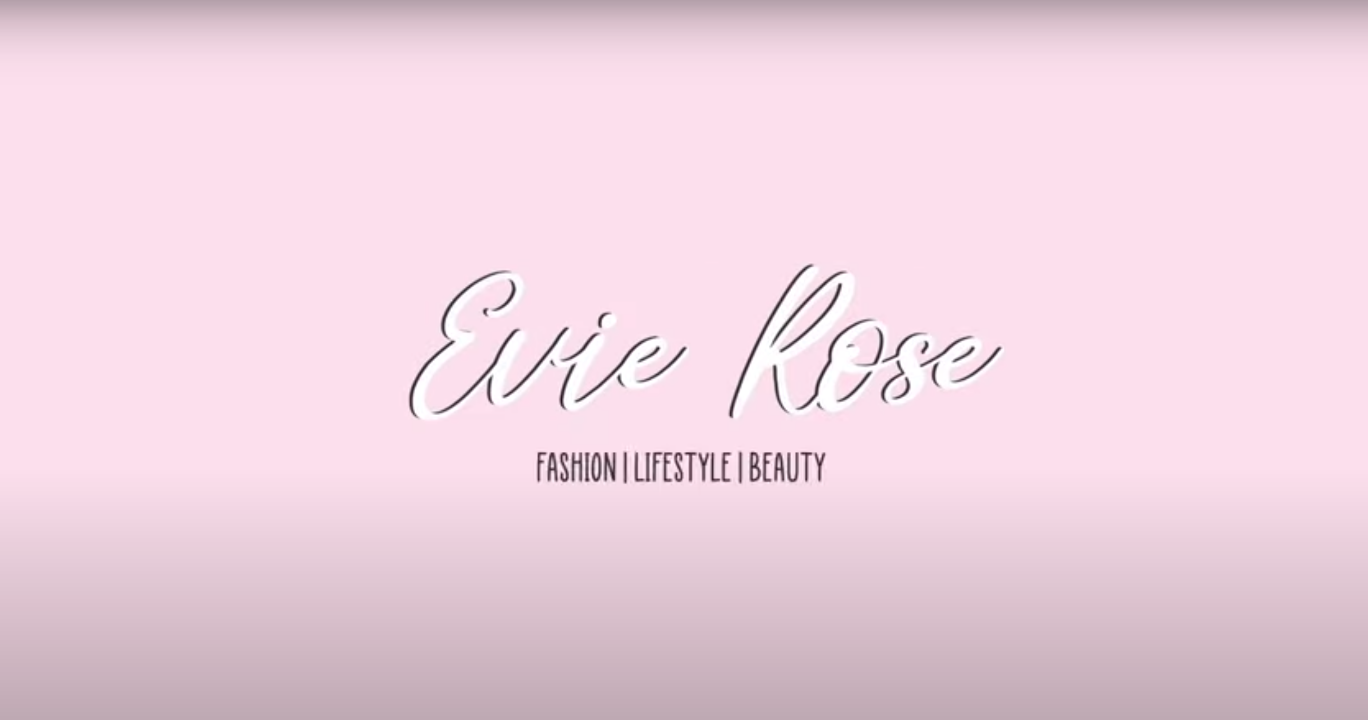 Pink background with cursive text that says "Evie Rose fashion beauty lifestyle"