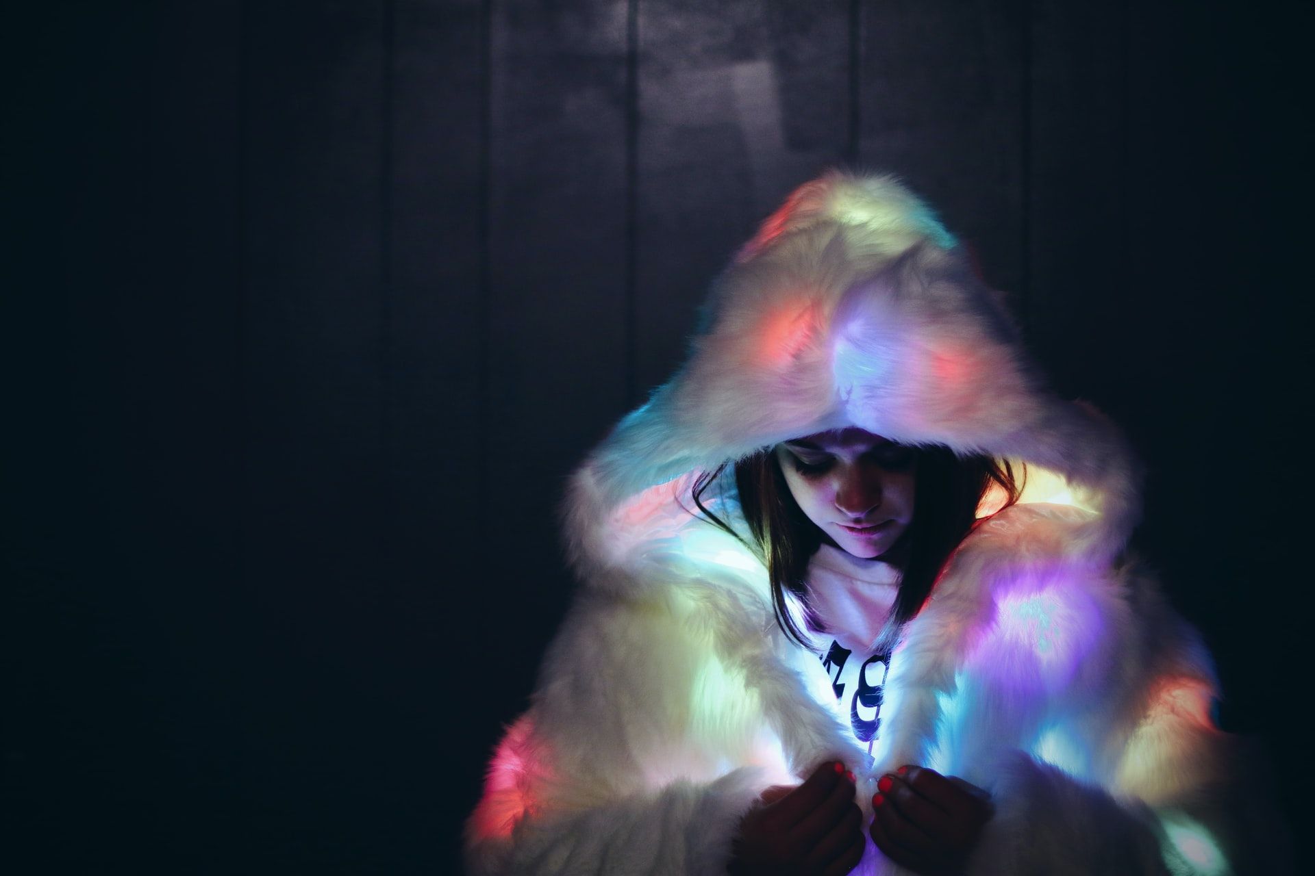Woman out at night with a light-up jacket